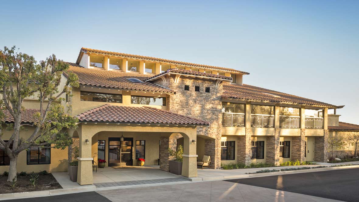 A modern residential building with a Mediterranean architectural style.