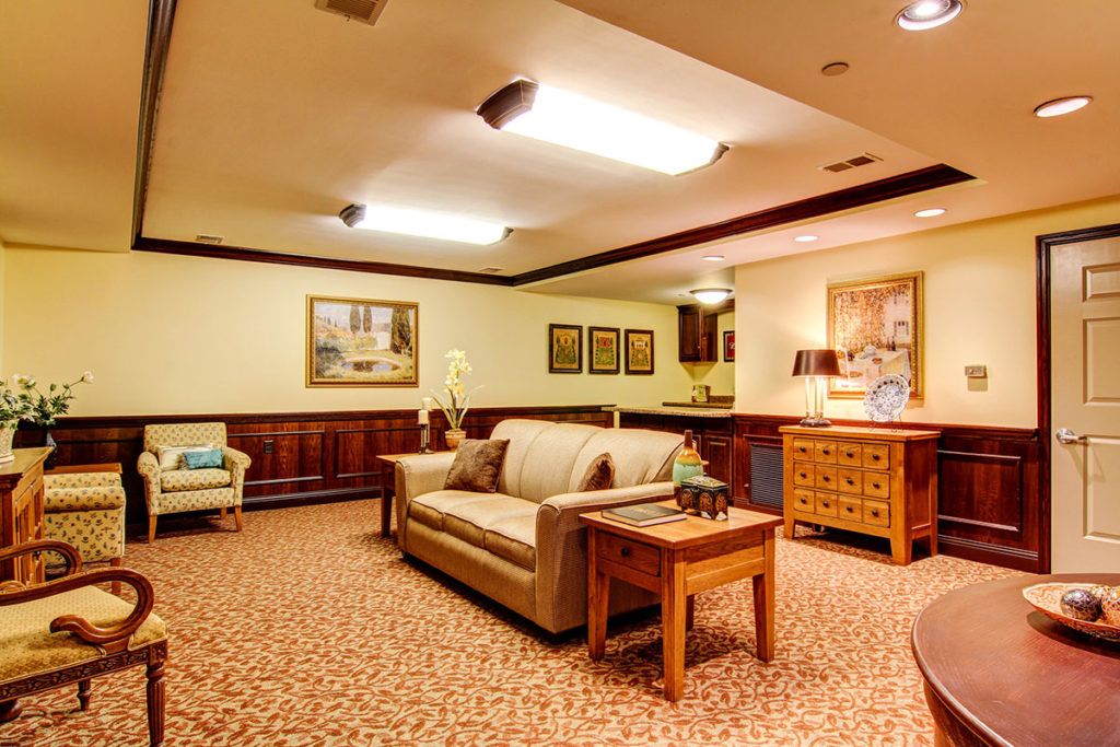A cozy living room with comfortable seating and warm lighting.