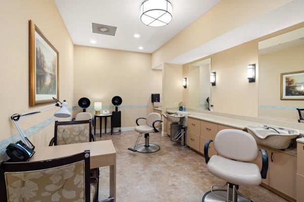An inviting hair salon interior with styling stations and modern decor.