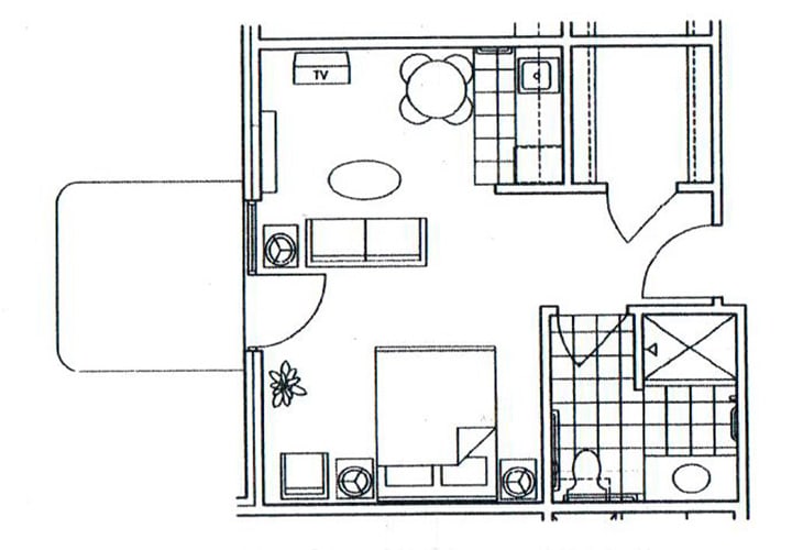 A floor plan of a small apartment showing the layout of rooms and furniture.