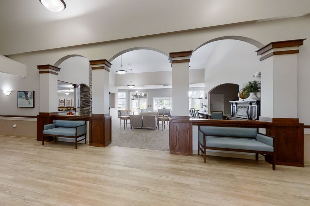 Spacious lobby area with archways and seating arrangements.