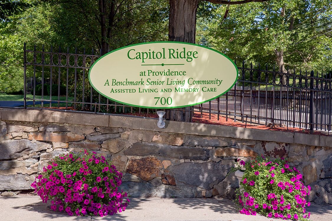 Entrance sign for Capitol Ridge, a senior living community offering assisted living and memory care.