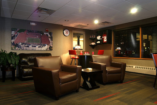 A cozy lounge area featuring comfortable chairs and ambient lighting.