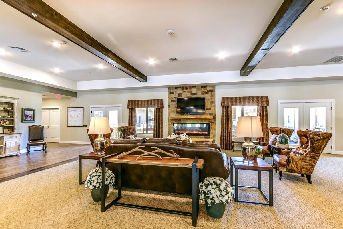 A cozy, modern living room with a fireplace and stylish decor.