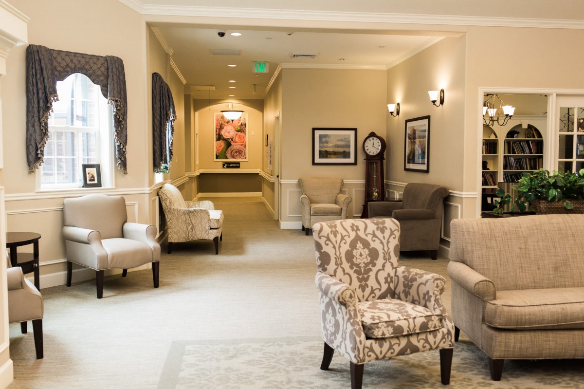 A cozy lobby area featuring comfortable armchairs, warm lighting, and elegant decorations.