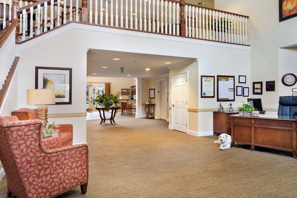 A spacious hotel lobby with elegant decor and comfortable seating.