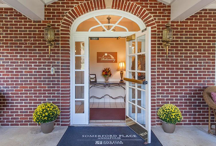 A welcoming entrance with open doors leading into a cozy interior.