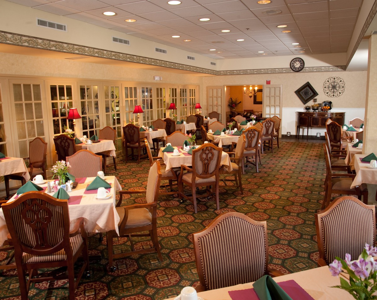 Elegant restaurant dining area with neatly arranged tables and chairs.