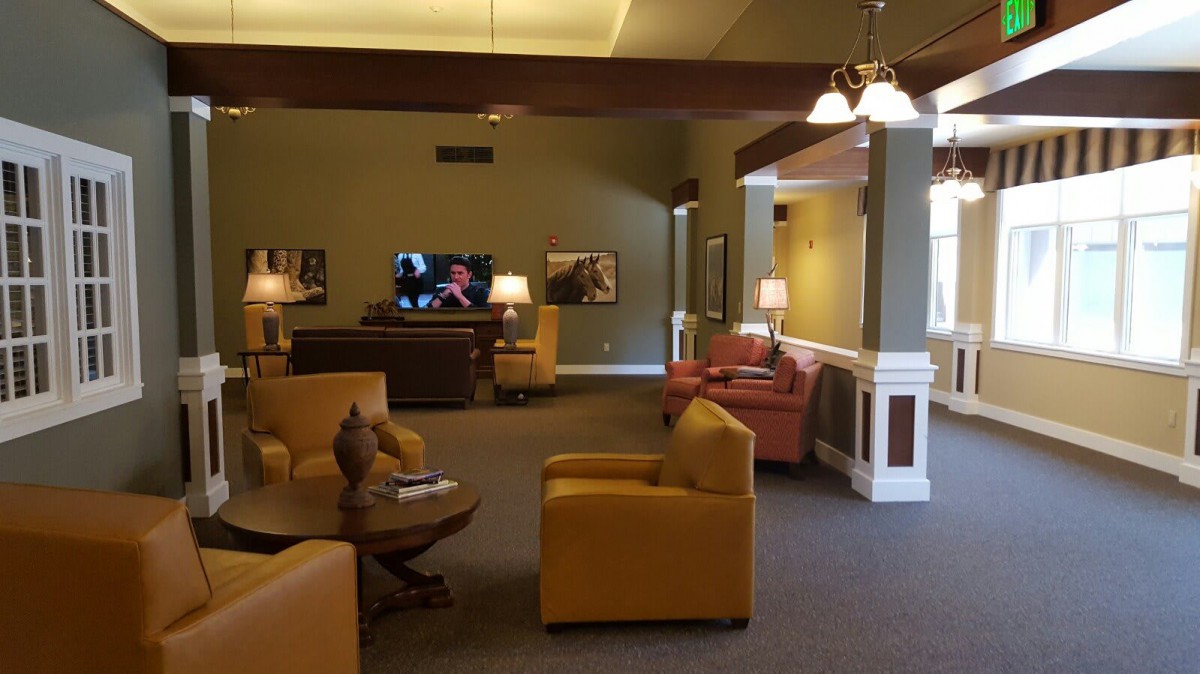 A comfortable lounge area with seating and a television.