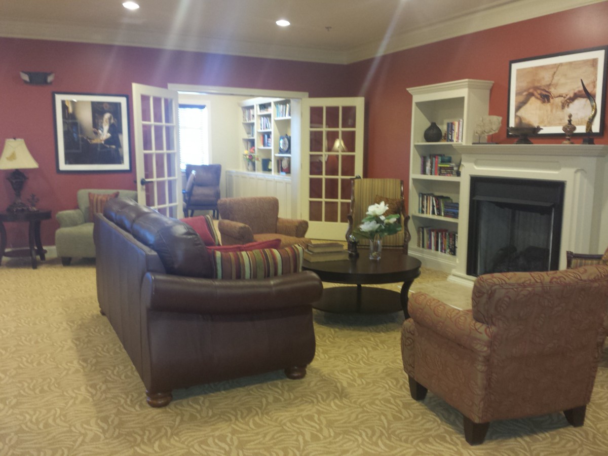 A cozy living room with comfortable seating and a fireplace.