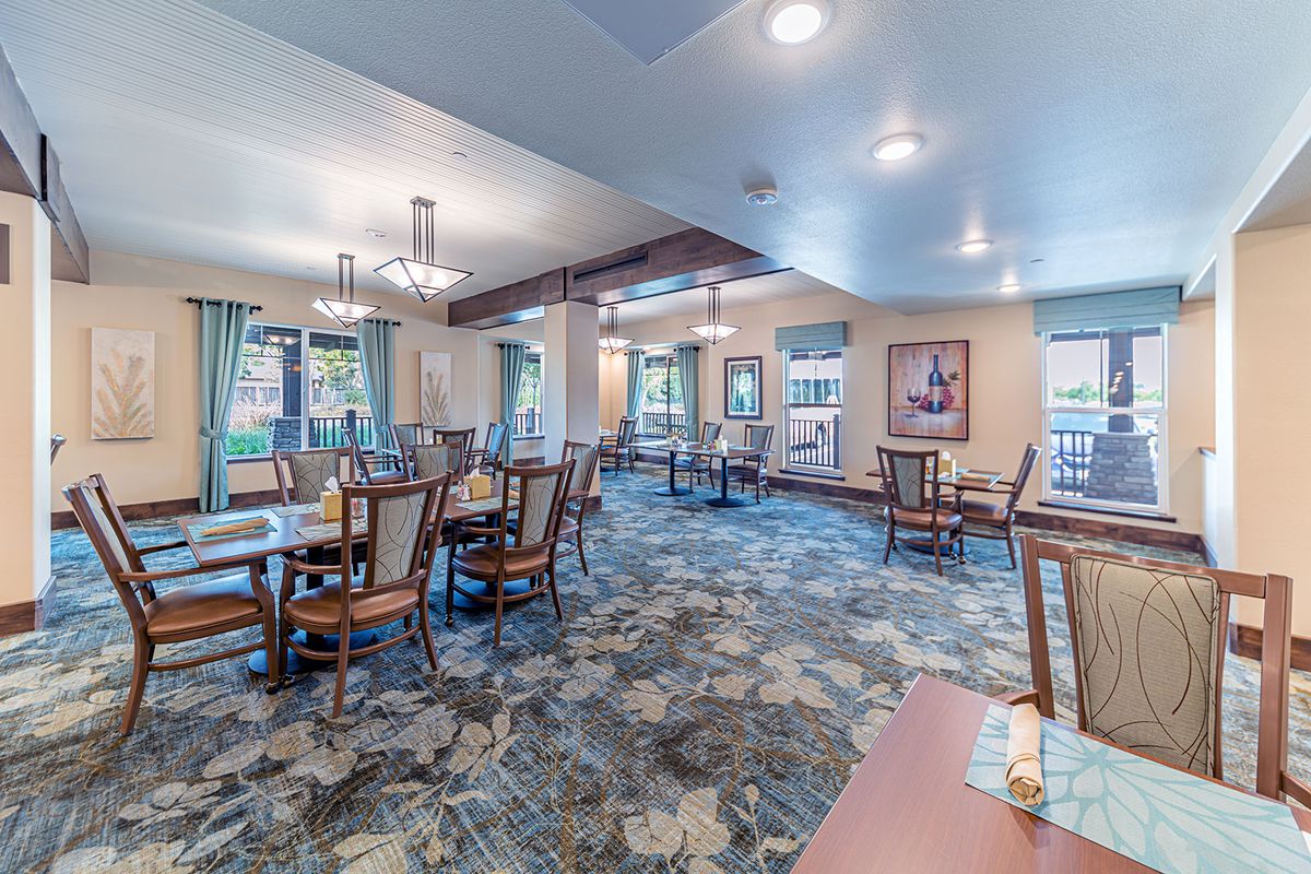 Spacious dining area with elegant furniture and natural lighting.