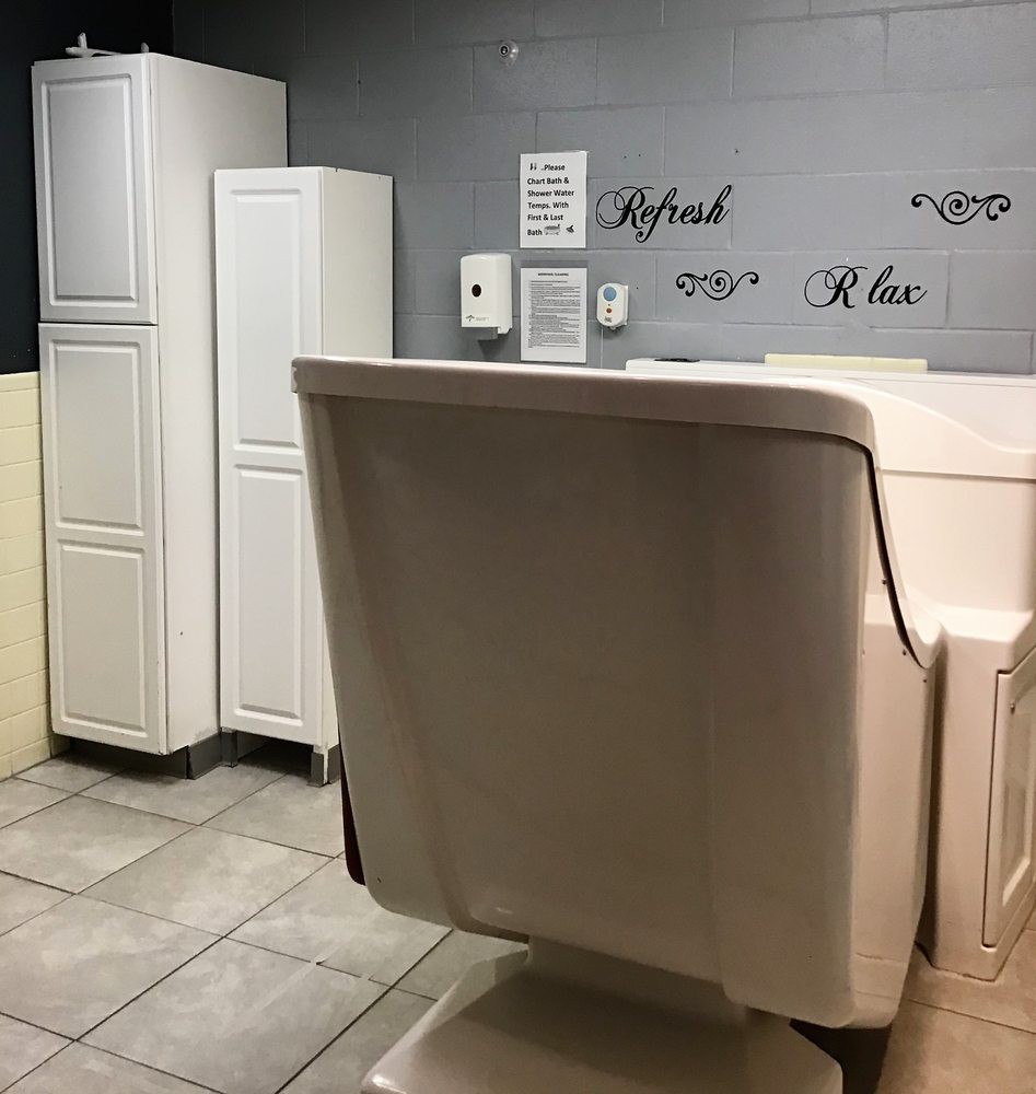 Stylish salon interior with a comfortable chair and sleek storage cabinets.