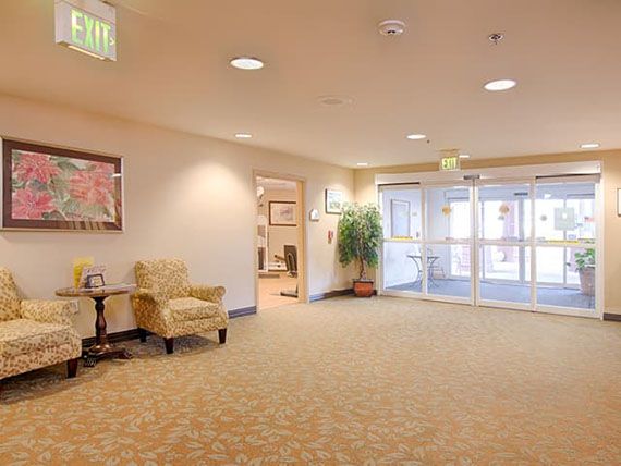 A well-lit, spacious lobby area with seating arrangements and decor.