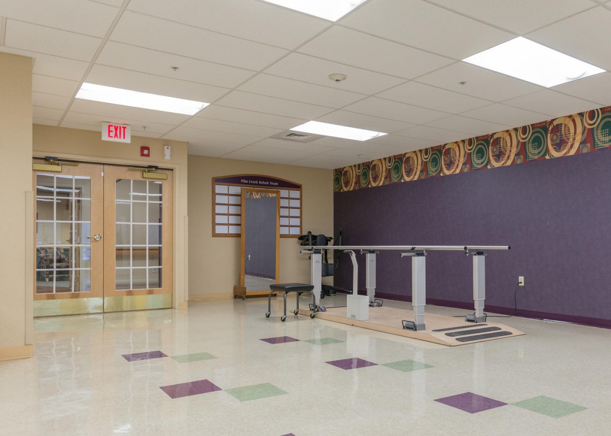 A spacious training room with fitness equipment and a clean, organized layout.