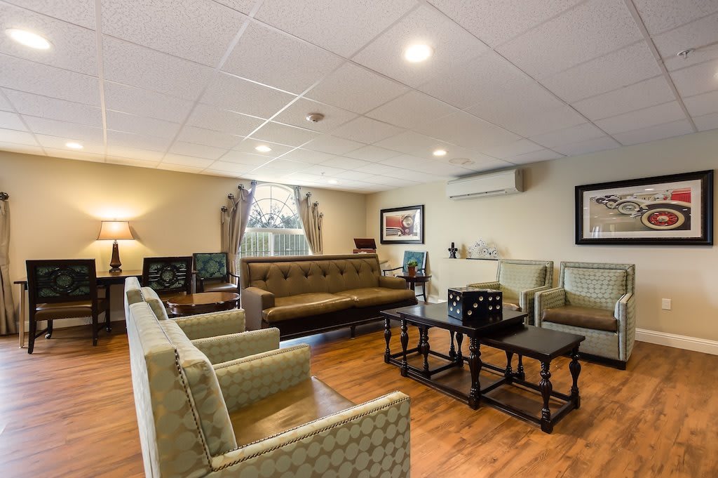 A cozy living room with comfortable seating and warm lighting.