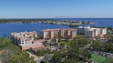 Aerial view of a residential area with buildings near a lake.