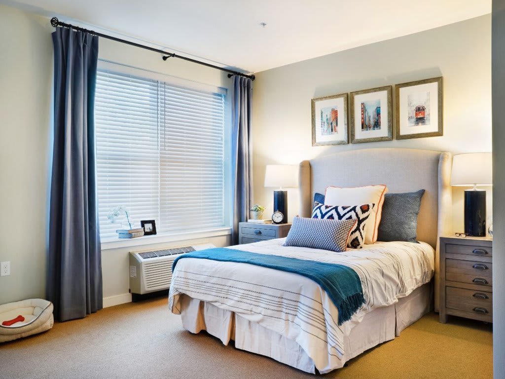 A modern and cozy bedroom with stylish decor and soft lighting.