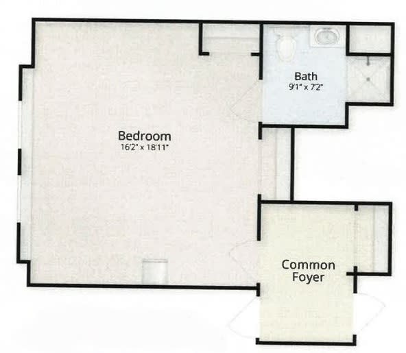 A floor plan featuring a bedroom, bathroom, and common foyer area.