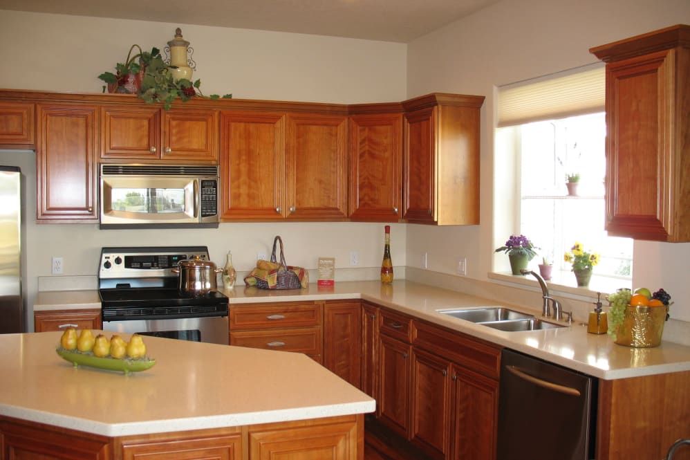 A well-equipped kitchen with wooden cabinets and modern appliances.