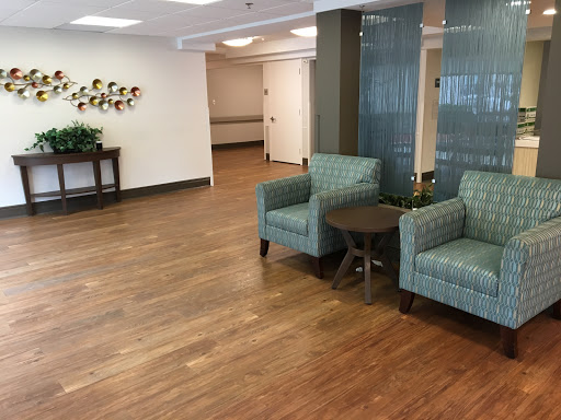 A cozy waiting area featuring comfortable chairs and natural light.