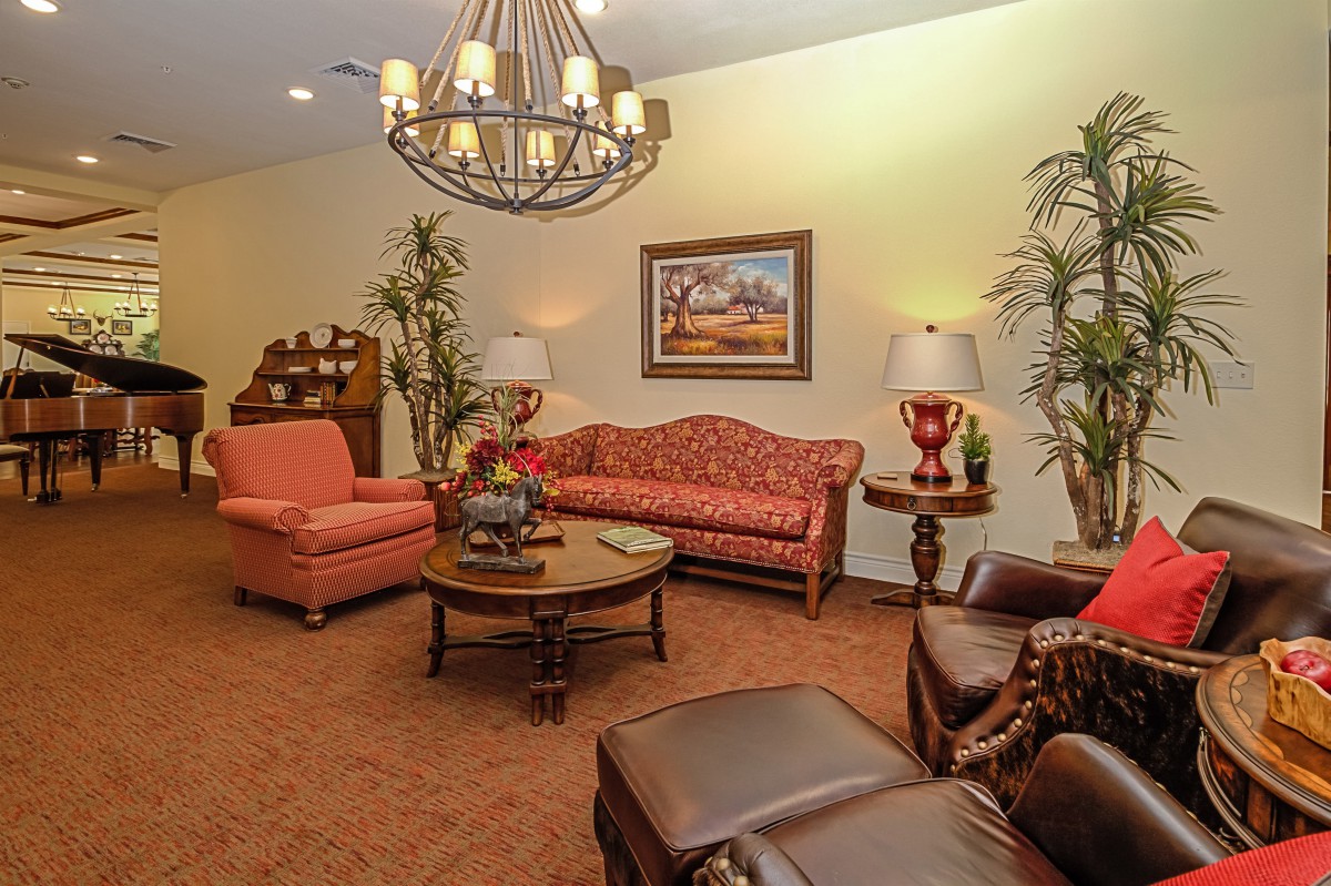 A cozy living room with classic furniture and warm lighting.