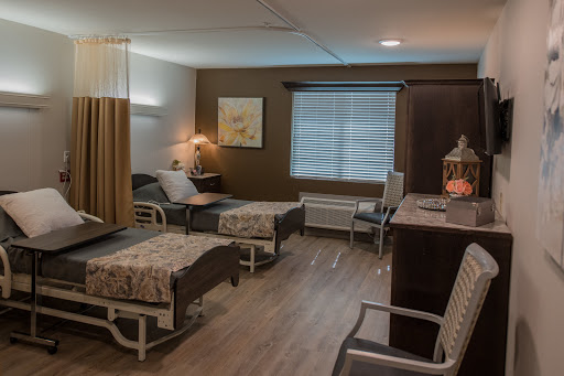 A well-organized and comfortable hospital room designed for patient care.