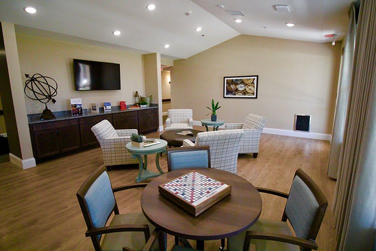A modern living room with comfortable seating and a television.