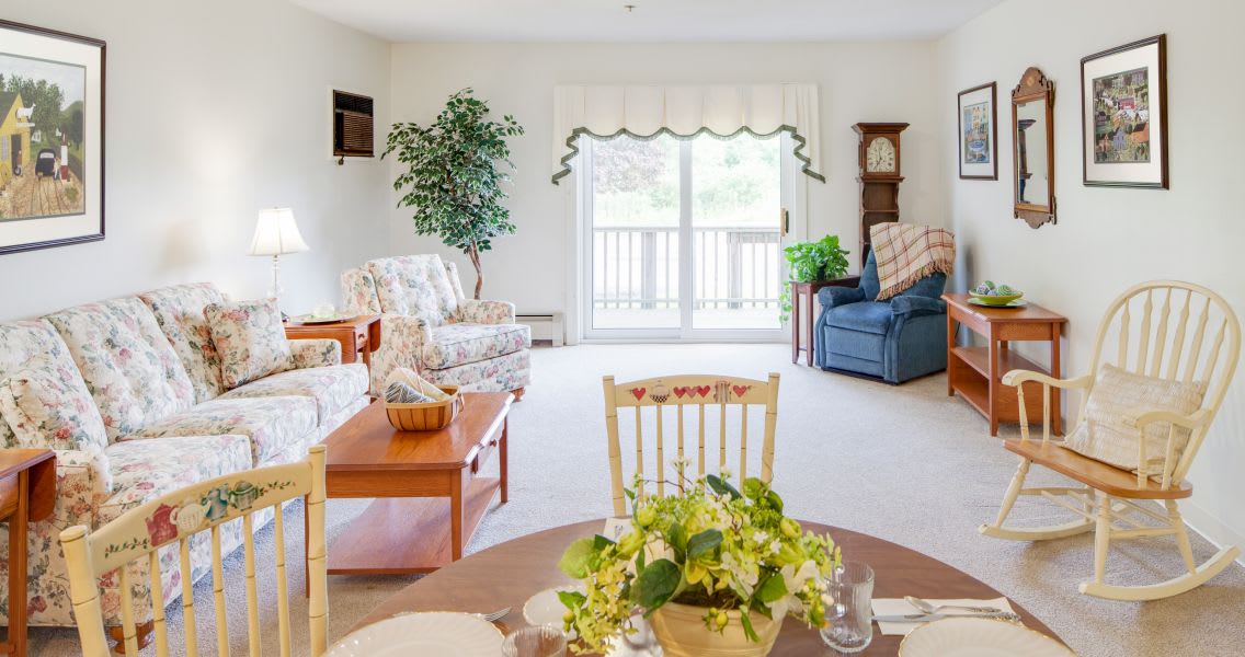 A bright and cozy living room with comfortable seating and classic decor.