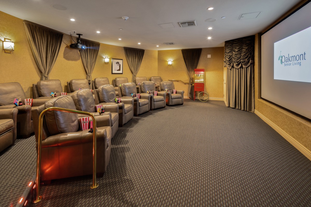 A cozy home theater with comfortable seating and elegant decor.