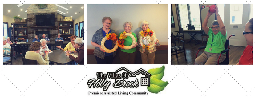 Elderly women at The Villas of Holly Brook displaying their handmade wreaths.