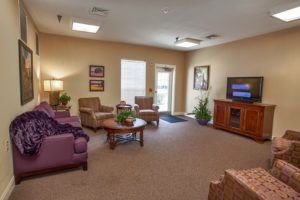 A cozy living room with comfortable seating and a television.