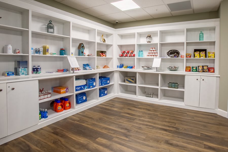 Organized retail store shelves displaying various products.