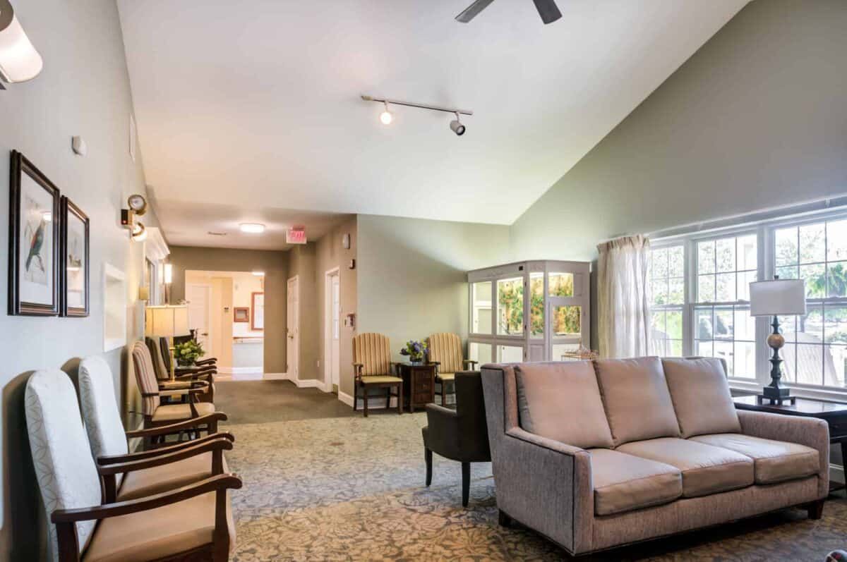 A cozy living room with comfortable seating and ample natural light.