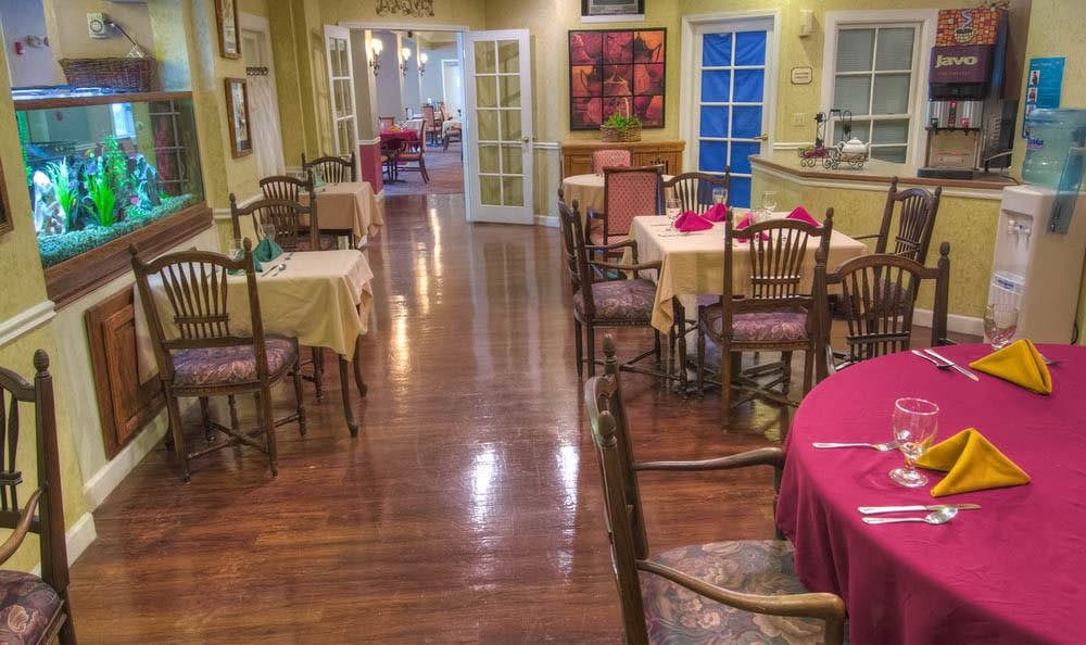 A cozy restaurant dining area with neatly arranged tables and chairs, ready for guests.