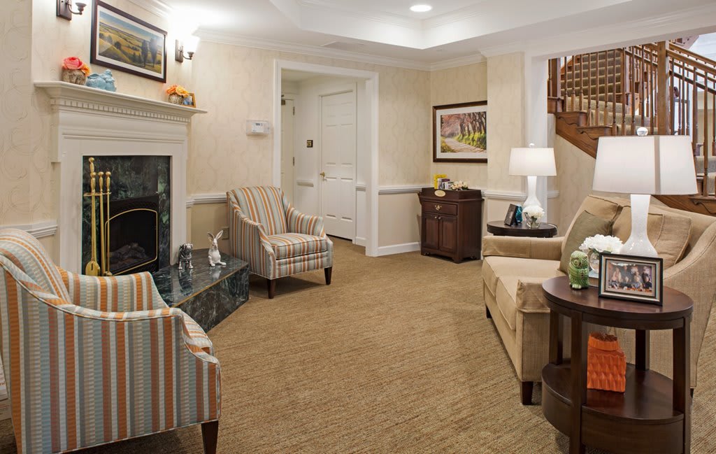 Cozy living room with comfortable seating and warm lighting.