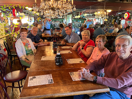 A lively group enjoying a meal together at a restaurant.