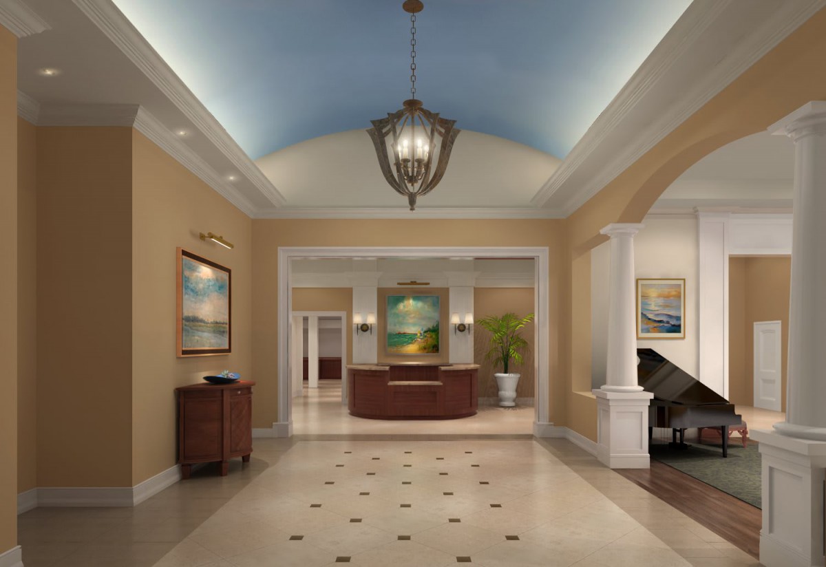 A spacious and elegantly decorated lobby with a reception desk, featuring soft lighting and tasteful artwork.