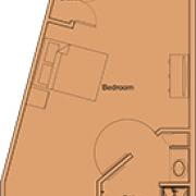 A schematic floor plan showcasing a bedroom layout.