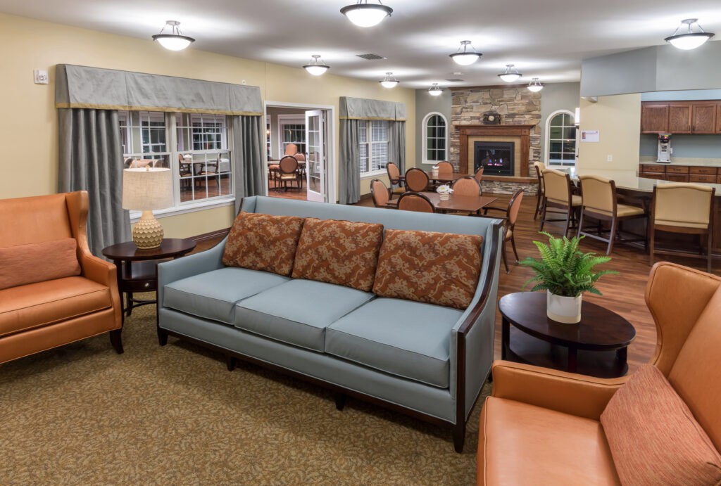 A cozy living room with comfortable seating and a fireplace.