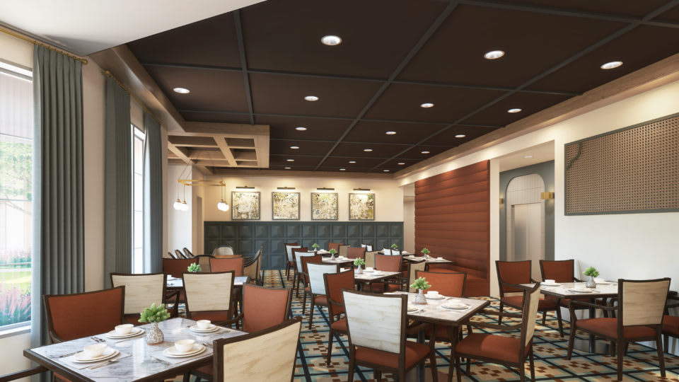 A modern restaurant interior with neatly arranged tables and chairs.