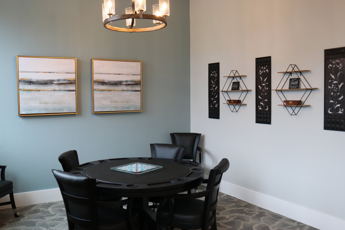 A modern dining room with elegant decor and a stylish round table.