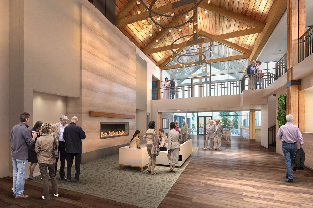 A modern lobby with people mingling and a wooden ceiling design.