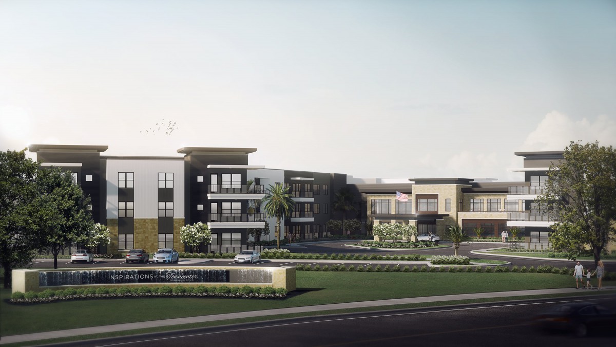 A modern apartment complex with contemporary design features, surrounded by landscaped greenery.