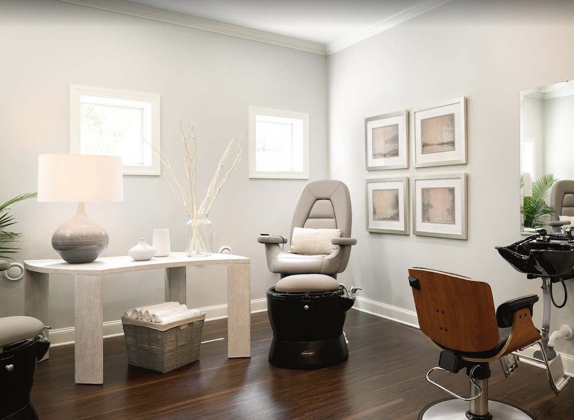 A modern spa room featuring a relaxation chair and contemporary decor.