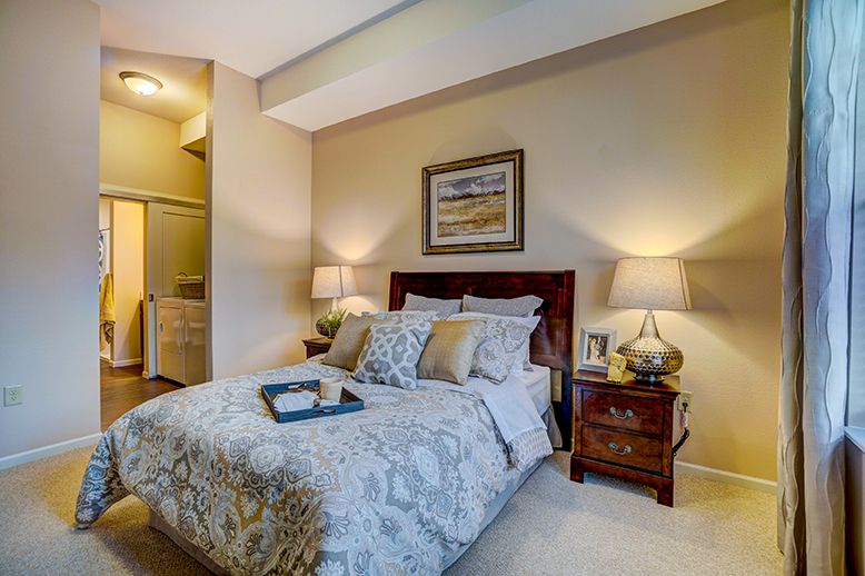 A cozy bedroom with elegant decor and soft lighting.