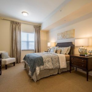 A cozy bedroom with elegant decor and soft lighting.