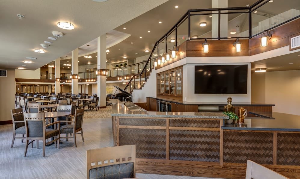 A modern restaurant interior with elegant lighting and spacious dining area.