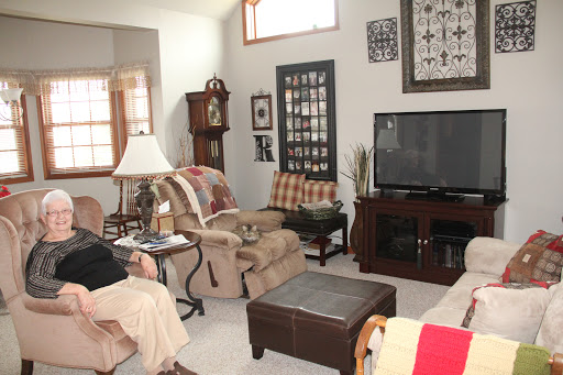 A cozy living room setup featuring comfortable seating and a television.