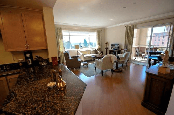A cozy living room with comfortable seating, large windows, and elegant decor.