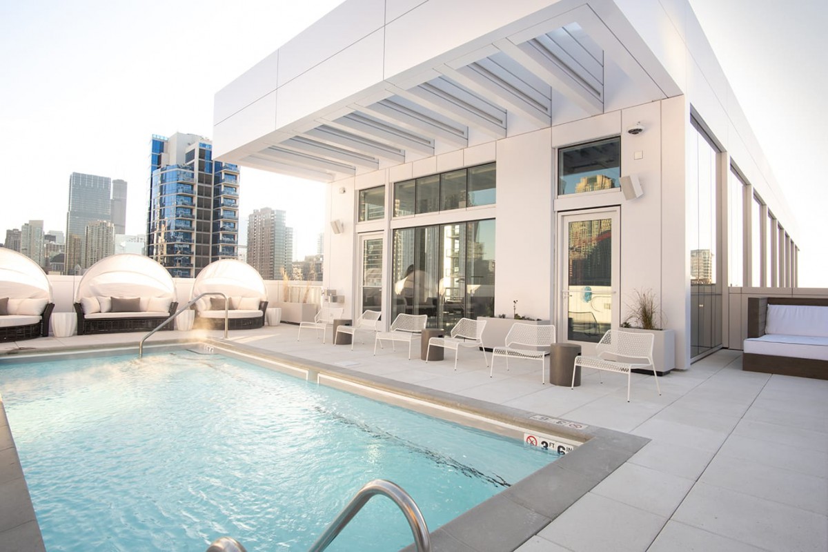 Luxurious rooftop pool in a modern urban setting.